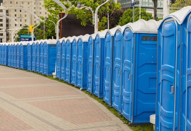 hygienic portable restrooms lined up at a music festival, providing comfort and convenience for attendees in Montebello CA